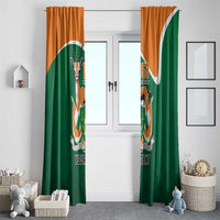 Green and orange window curtain set with crest emblem and 'YOUR TEXT' on fabric