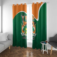 Green and orange window curtain pair with crest emblem and 'YOUR TEXT' on grommet top
