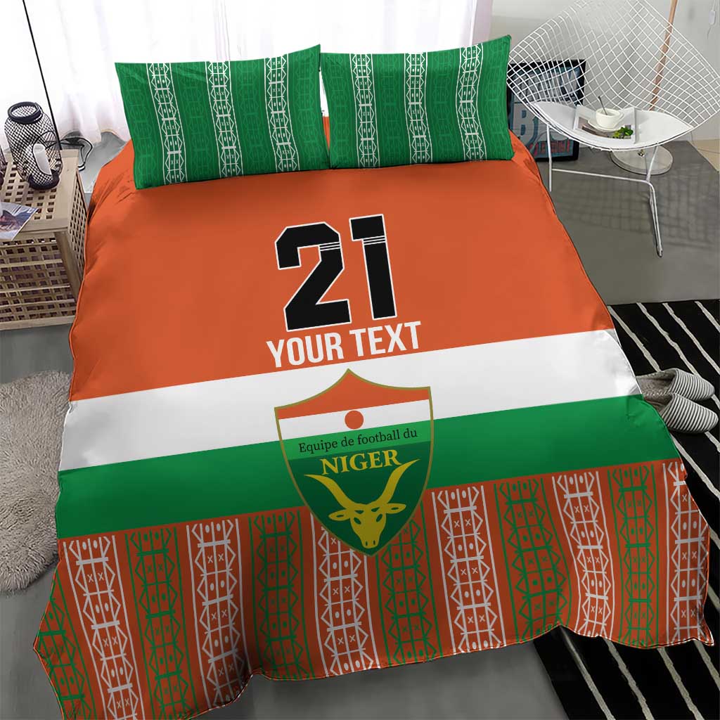 Custom bedding set with orange center, green stripe, patterned bottom, and number 21