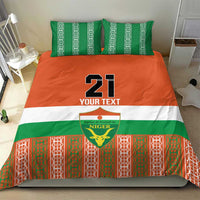 Custom bedding set with number 21 on orange panel, green stripe, and red/green patterned base