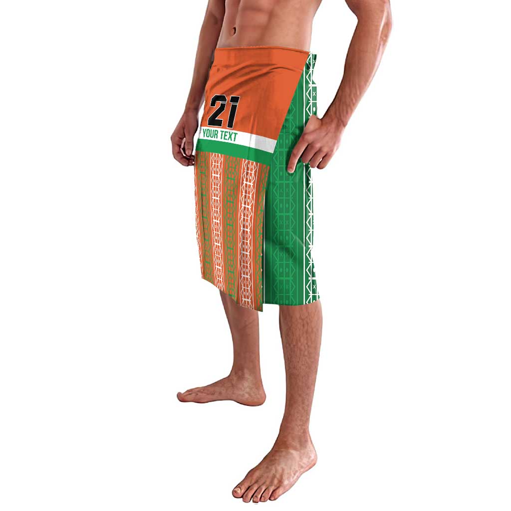 Custom soccer lavalava shorts, orange top panel and green side panels, number 21