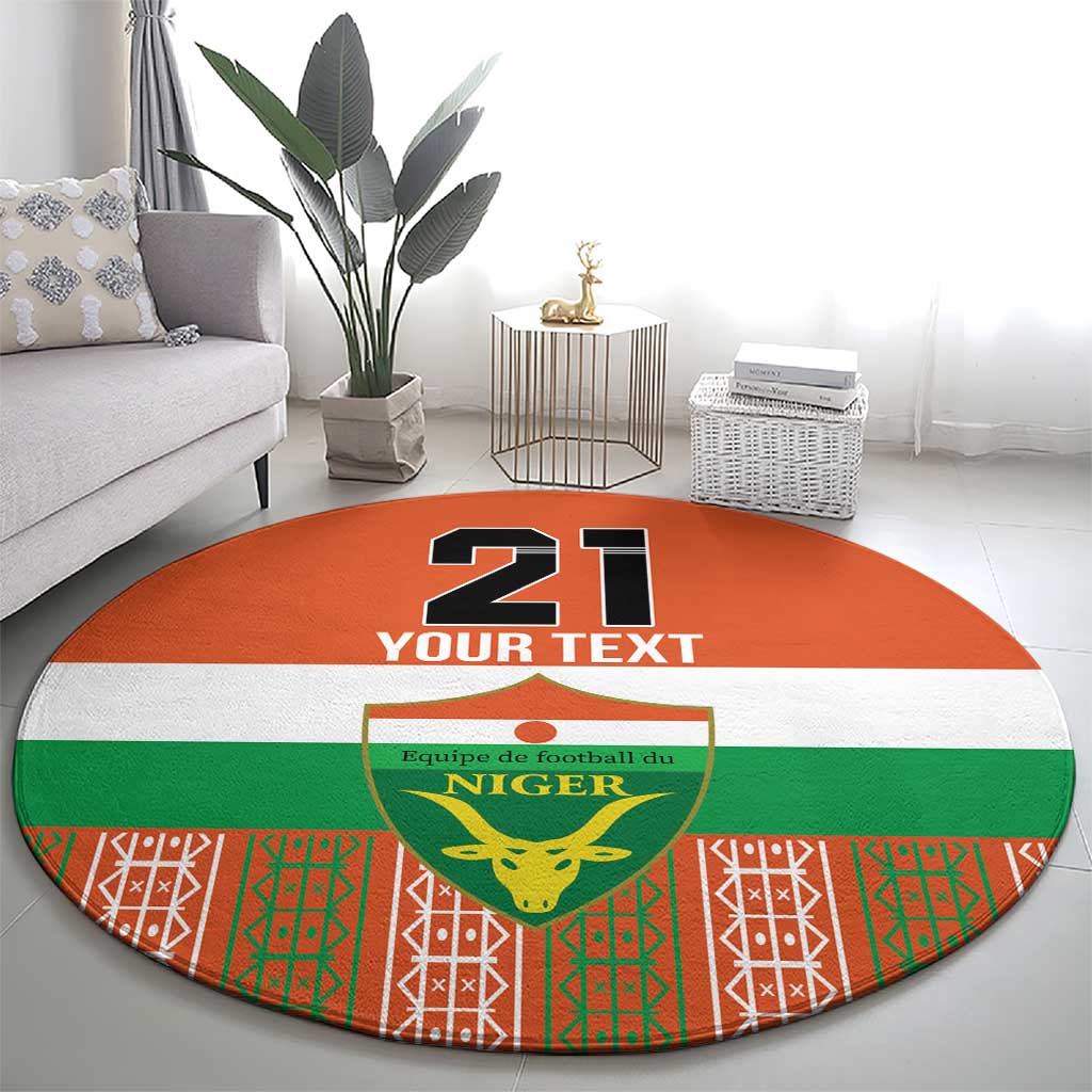 Orange round carpet with large '21' and 'YOUR TEXT' above Niger crest shield