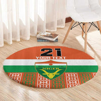 Orange round custom carpet with '21 YOUR TEXT' and Niger crest, patterned green red trim