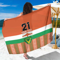 Orange custom football team sarong with Niger flag stripe, crest and number print