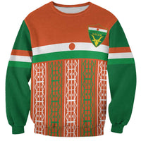 Orange and green custom football sweatshirt with crest logo and geometric panel front