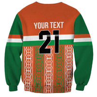 Back of orange and green custom sweatshirt with large number 21 and 'YOUR TEXT'