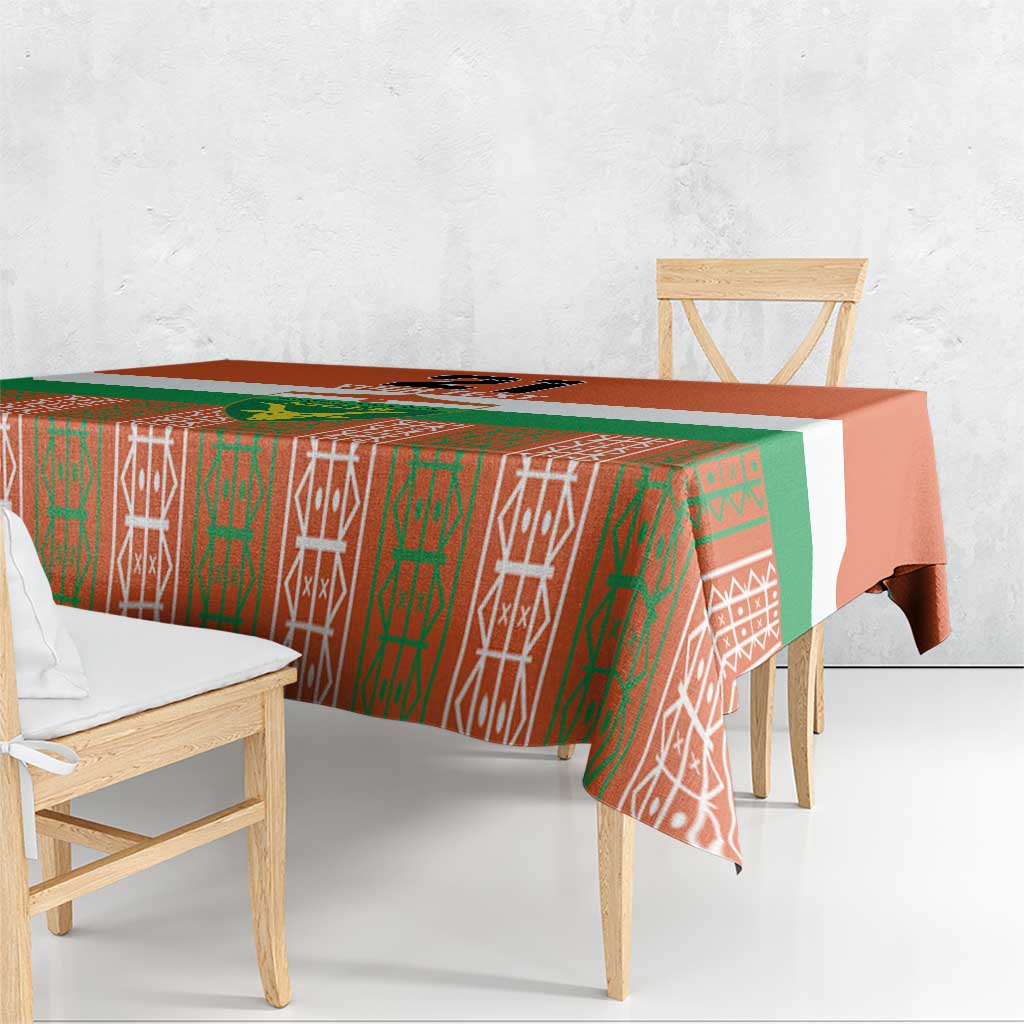 Orange tablecloth with green and white geometric pattern, covering table