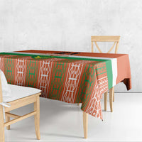 Orange tablecloth with green and white geometric pattern, covering table