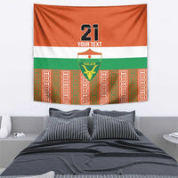 Orange tapestry showing '21' and Niger crest on white/green stripes with patterned red border.