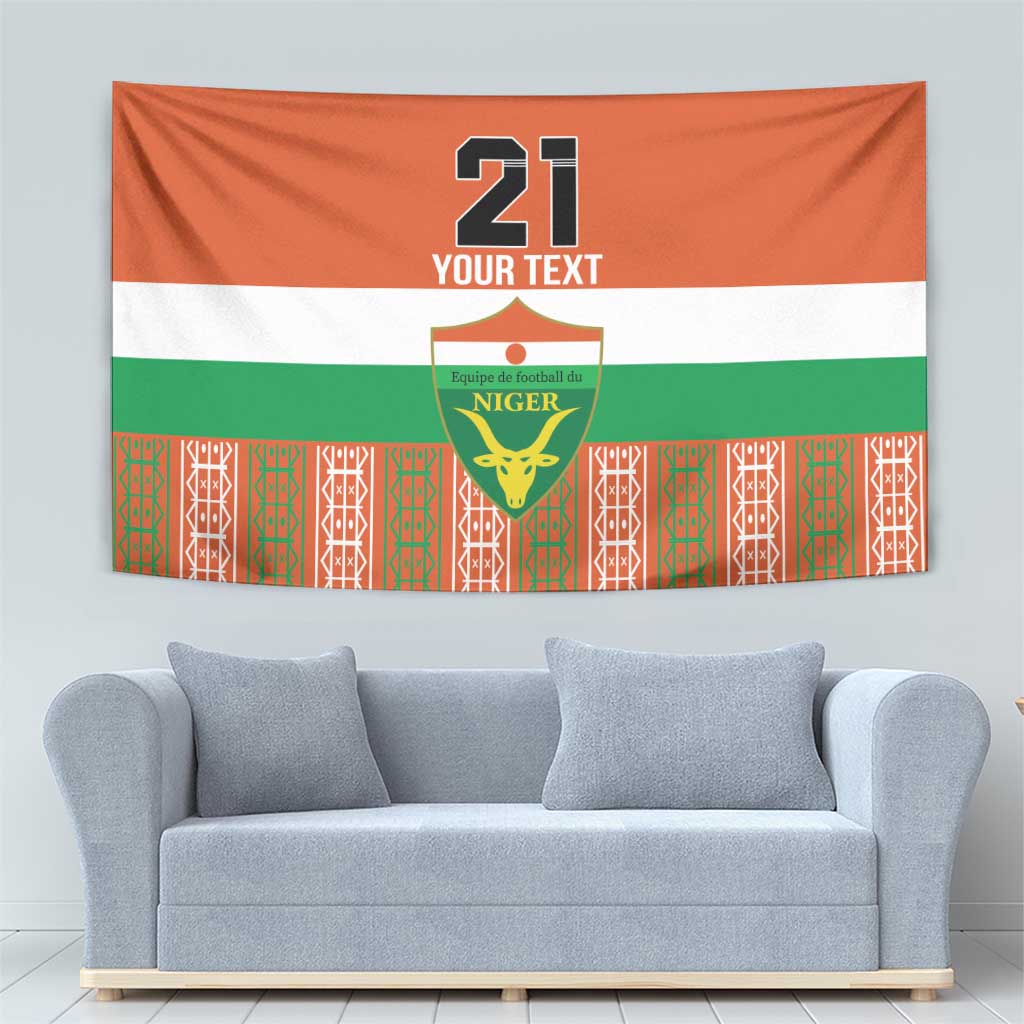 Orange flag tapestry with '21' text, Niger crest, white and green stripes.