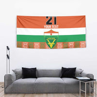 Orange fabric tapestry with '21 YOUR TEXT', Niger crest, and vertical patterned border.