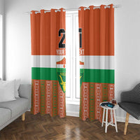 Custom window curtain panels with hooked header, orange/white/green Niger design, number 21.
