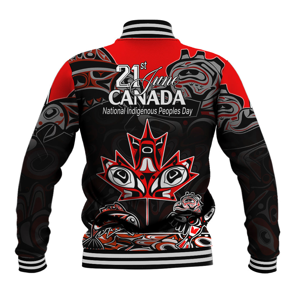 Back of red baseball jacket with black Indigenous art graphic and 21 June Canada text