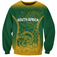 Green crewneck sweatshirt with long sleeves, yellow South Africa graphic front