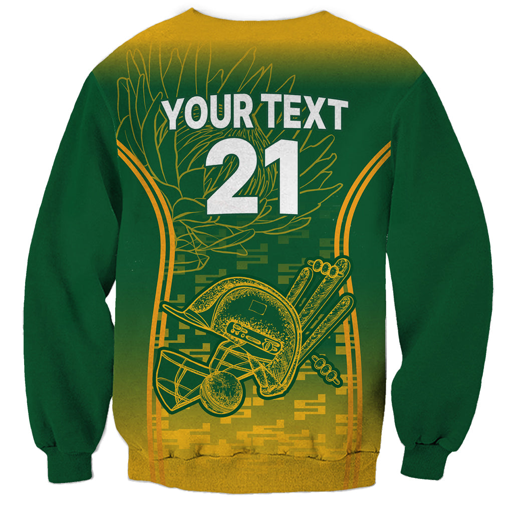 Green crewneck sweatshirt with long sleeves, yellow 21 and back graphic print