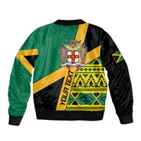 Green bomber jacket with black sleeves and yellow crest center, geometric flag graphic