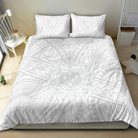 Kids white bedding set with two pillows and patterned duvet with emblem and island motifs
