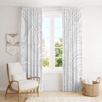 White window curtains with subtle gray geometric print, framed by two curtains on rail