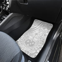 White Polynesian-pattern car floor mats with tropical leaves and star crest, rear seat area