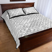 White quilt bed set with two pillowcases, tropical geometric pattern and black trim