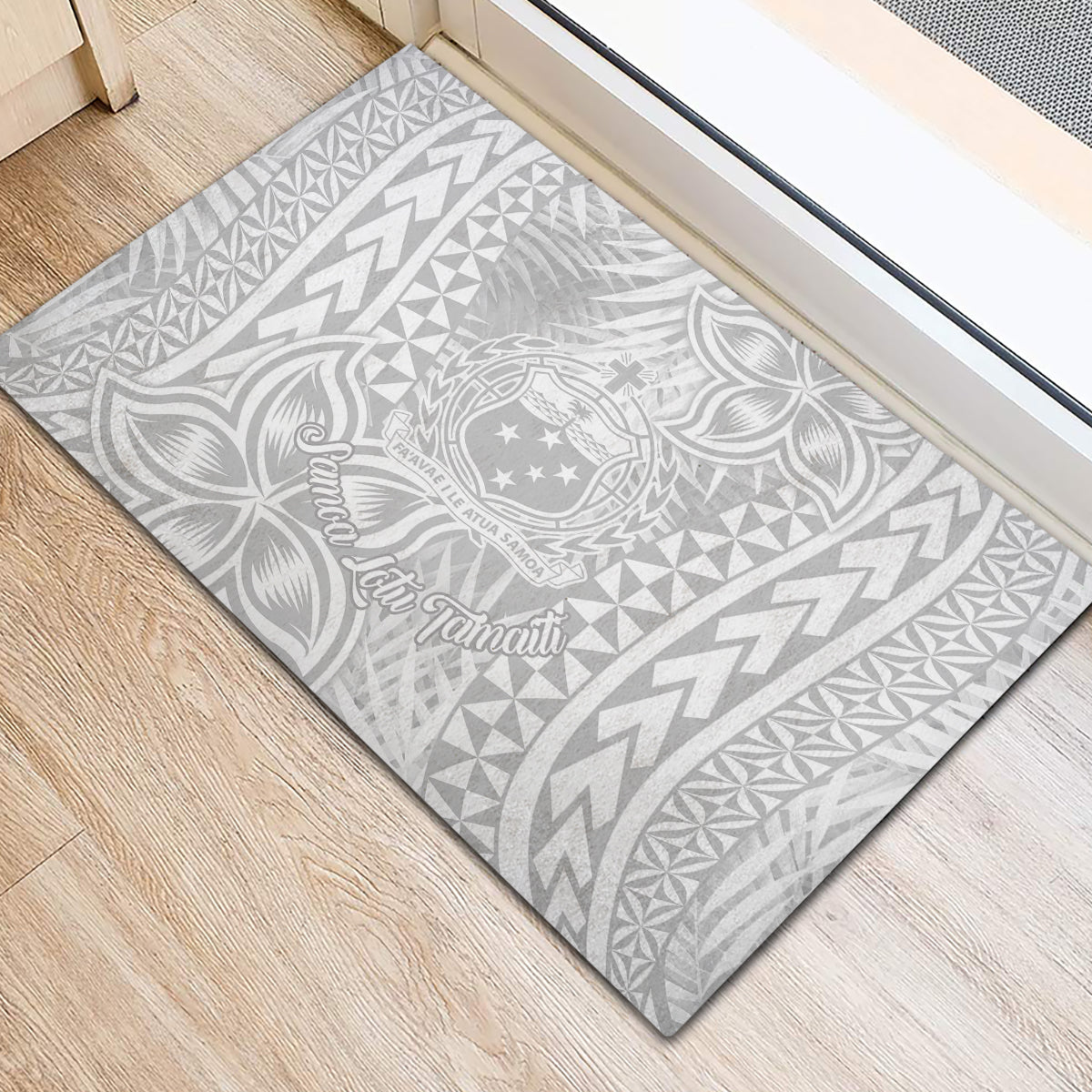 Rectangular rubber doormat featuring light gray background with white tropical leaf and arrow motifs