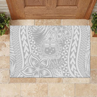Rectangular rubber doormat showing light gray and white Polynesian crest in center