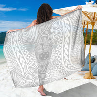 White Polynesian print sarong wrap with central crest and geometric border.