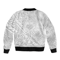 White unisex bomber jacket with allover leaf/geometric print and crest logo on back, black rib hem