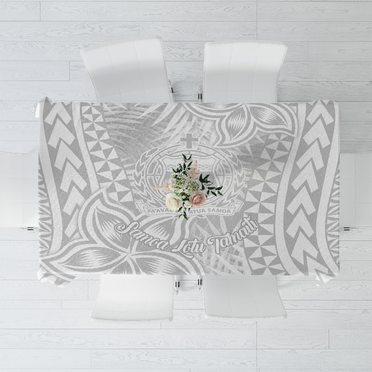 White and gray tablecloth with Polynesian-style botanical and geometric pattern.