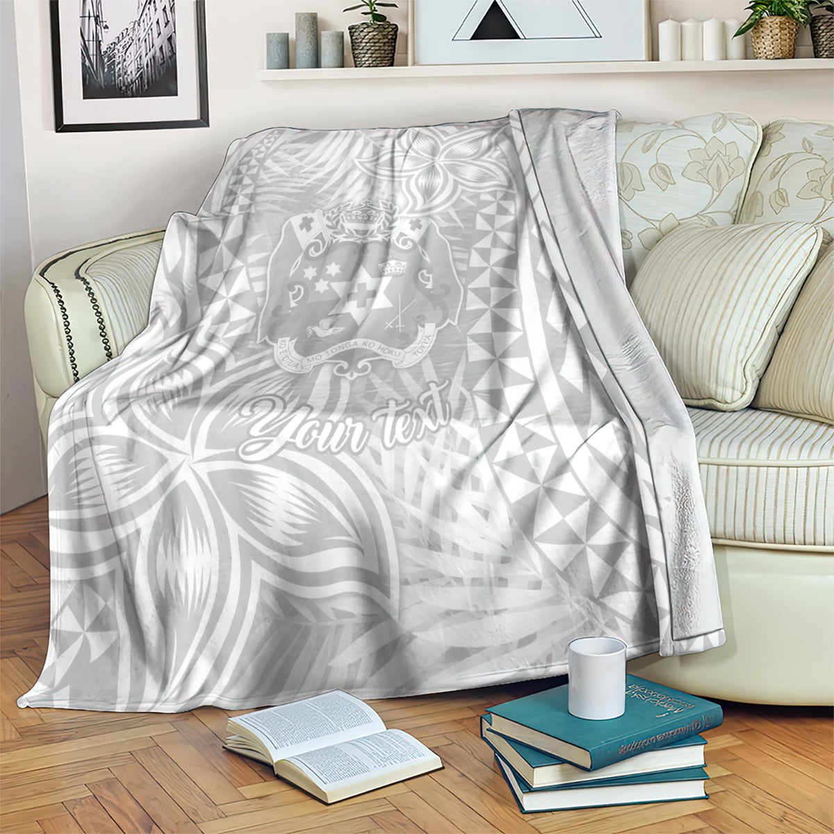 Personalized white blanket with gray Polynesian crest and “Your text” script, leaf and triangle motifs