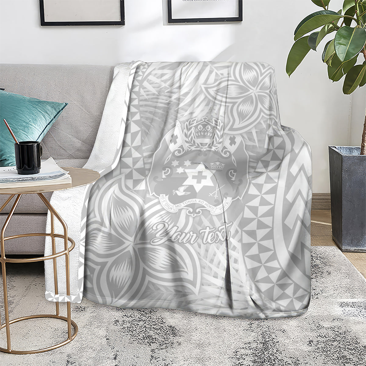 Personalized white blanket with gray Polynesian crest and “Your text” script, leaf and triangle pattern