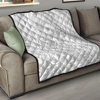 White quilt blanket with black trim, tropical polynesian pattern, quilted texture