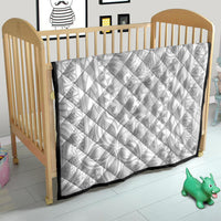 White quilt blanket with black border, polynesian-inspired motifs and personalised text