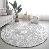 Round gray rug with white Polynesian medallion, leaf swirls, and “Your text”