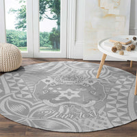 Round gray rug with white Polynesian crest and geometric pattern, “Your text”