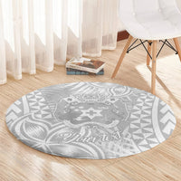 Round gray rug with white Polynesian center design and “Your text” lettering