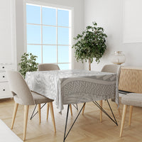 Tablecloth on dining table in white with gray geometric Polynesian pattern