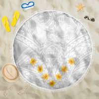 Round white beach blanket with gray tribal pattern, yellow plumeria flowers, and fringe