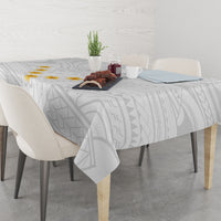 Gray geometric tablecloth with scalloped drape and corner drop at dining table