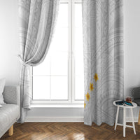 White window curtain with gray geometric design and yellow plumeria on one side