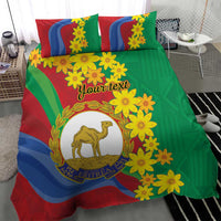 Green, red, and blue bedding set featuring yellow blossoms and camel logo