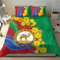 Green duvet with matching pillowcases, yellow flower design, and camel crest