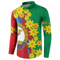 Green and red button sweatshirt with yellow flowers and central emblem featuring blue sky