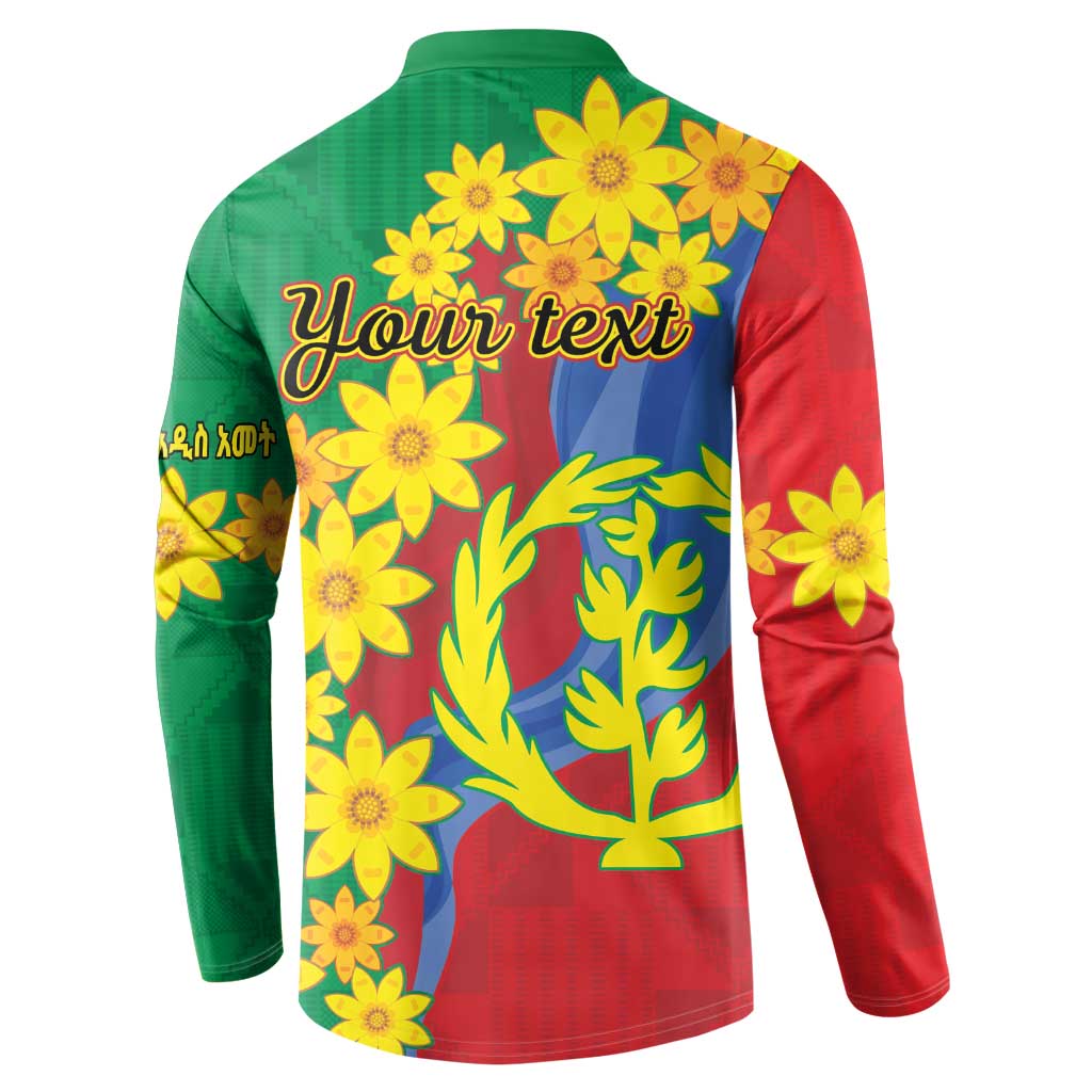 Green and red button sweatshirt, back shows yellow flowers around tree and waves