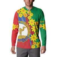 Green and red button sweatshirt with yellow floral print and central Eritrea emblem graphic
