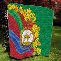 Green quilt with Eritrea flag stripes, yellow blossoms, camel crest, and custom text.