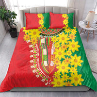 Green, red, and yellow floral bedding set with matching pillowcases and decorative center pattern.
