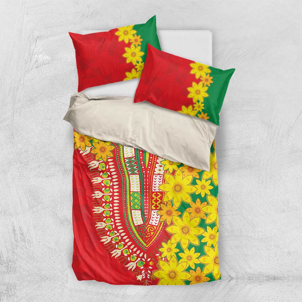 Red, green, and yellow bedding set with floral pattern and two red pillowcases over a white sheet.