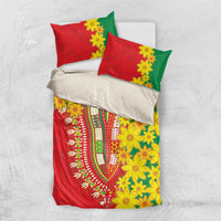Red, green, and yellow bedding set with floral pattern and two red pillowcases over a white sheet.