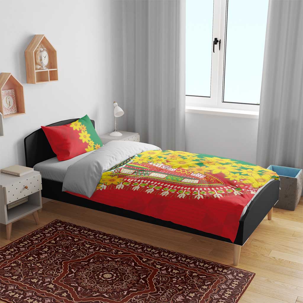 Bedding set with red and green floral duvet cover, yellow flower design, and two pillowcases.